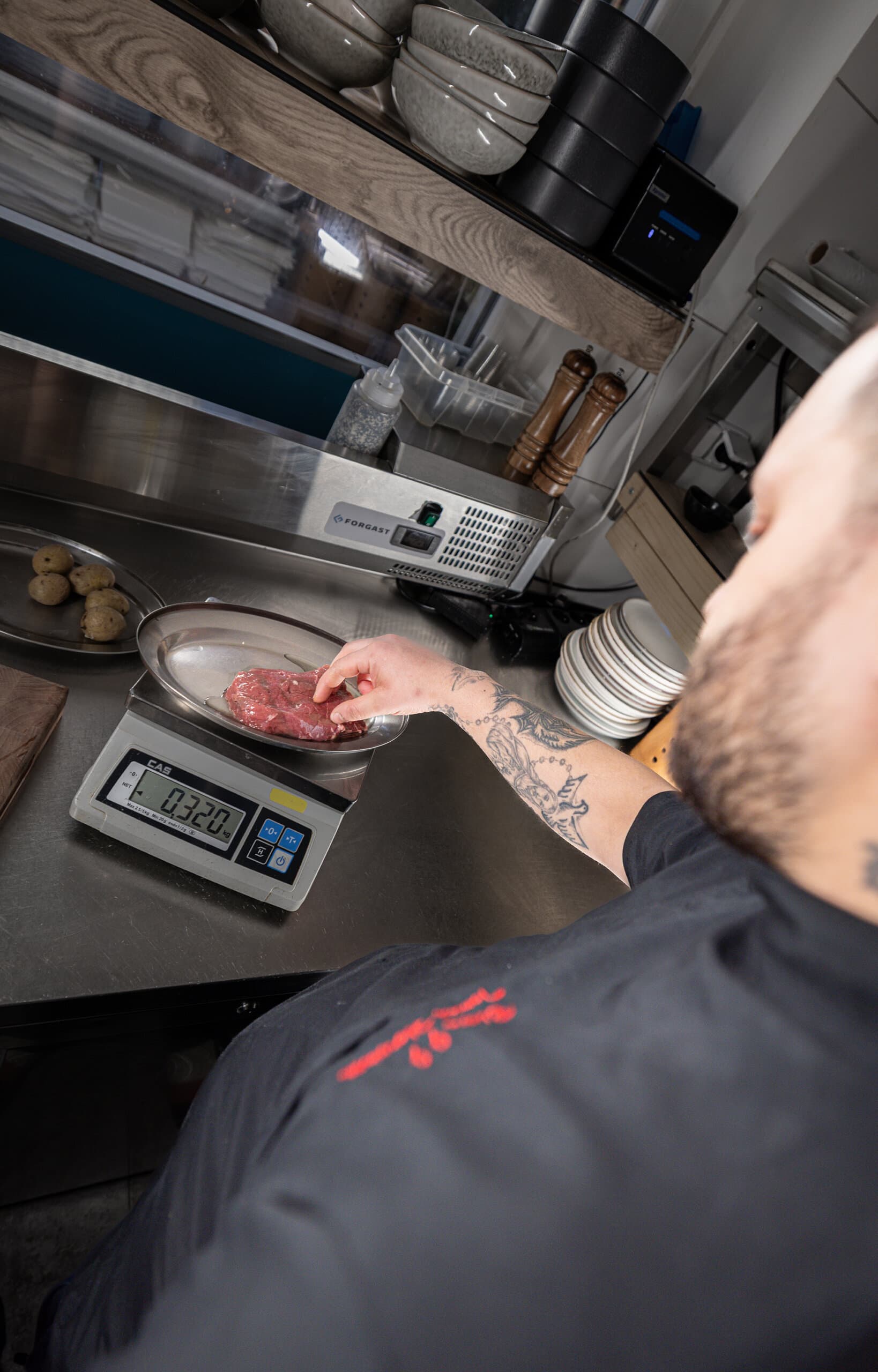 Portioning meat on a kitchen scale