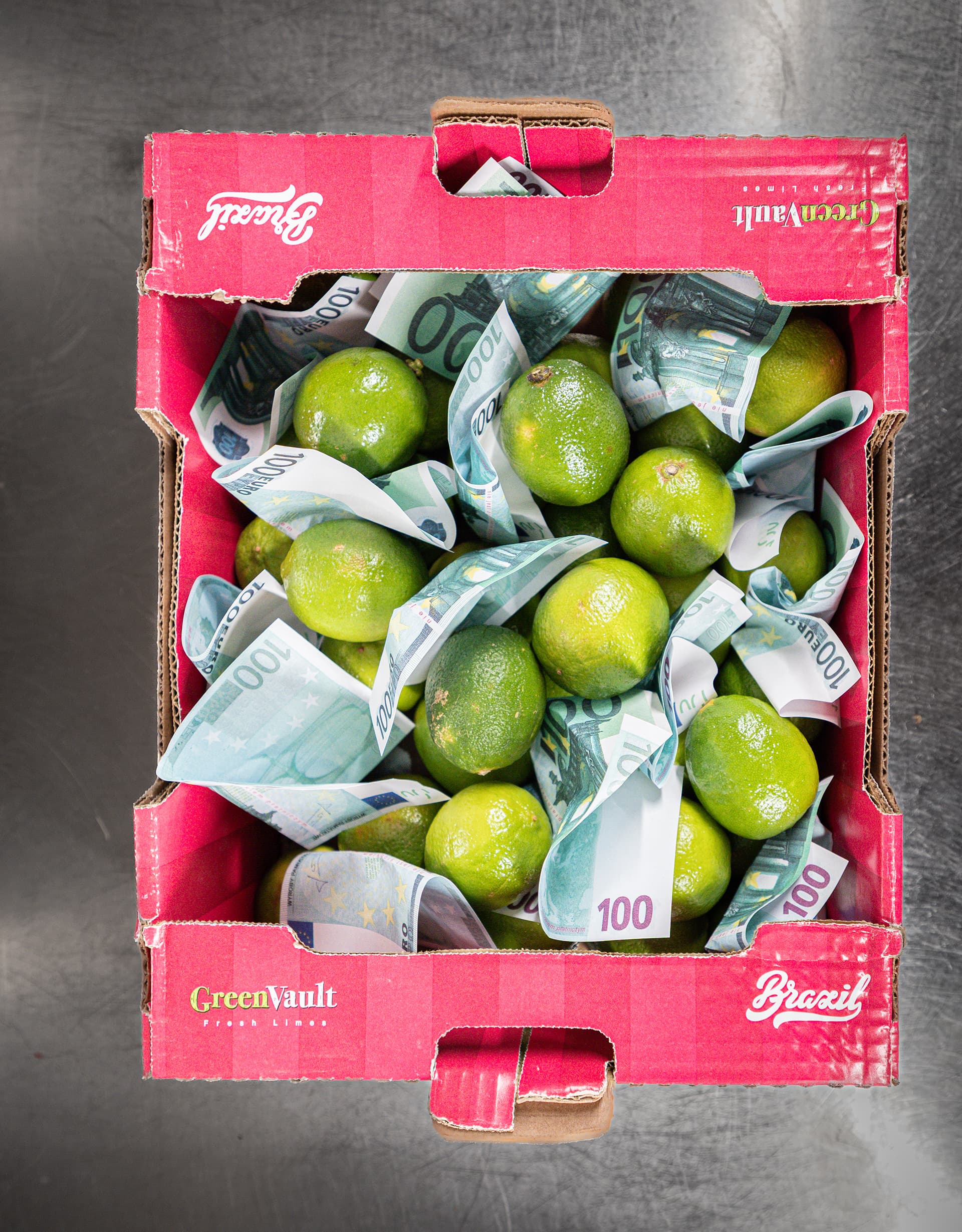 A crate of limes with banknotes among them